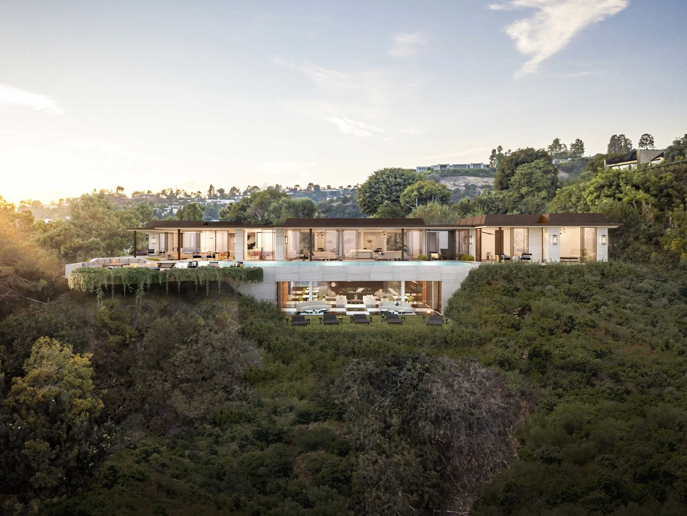 Modern luxury house on a hillside, surrounded by greenery.