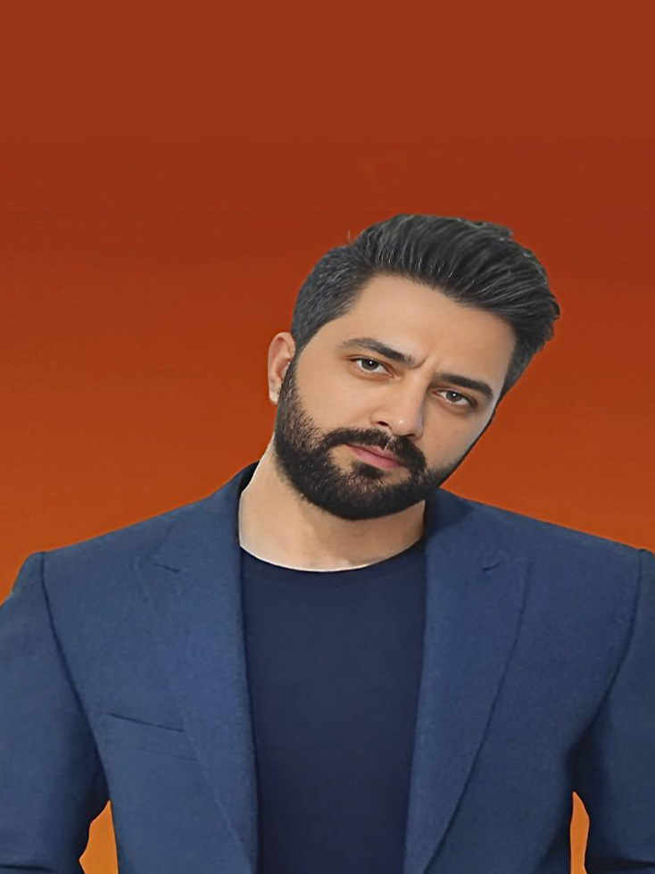 Black and white photo of a man in a dress shirt and tie leaning forward, with abstract art in the background.