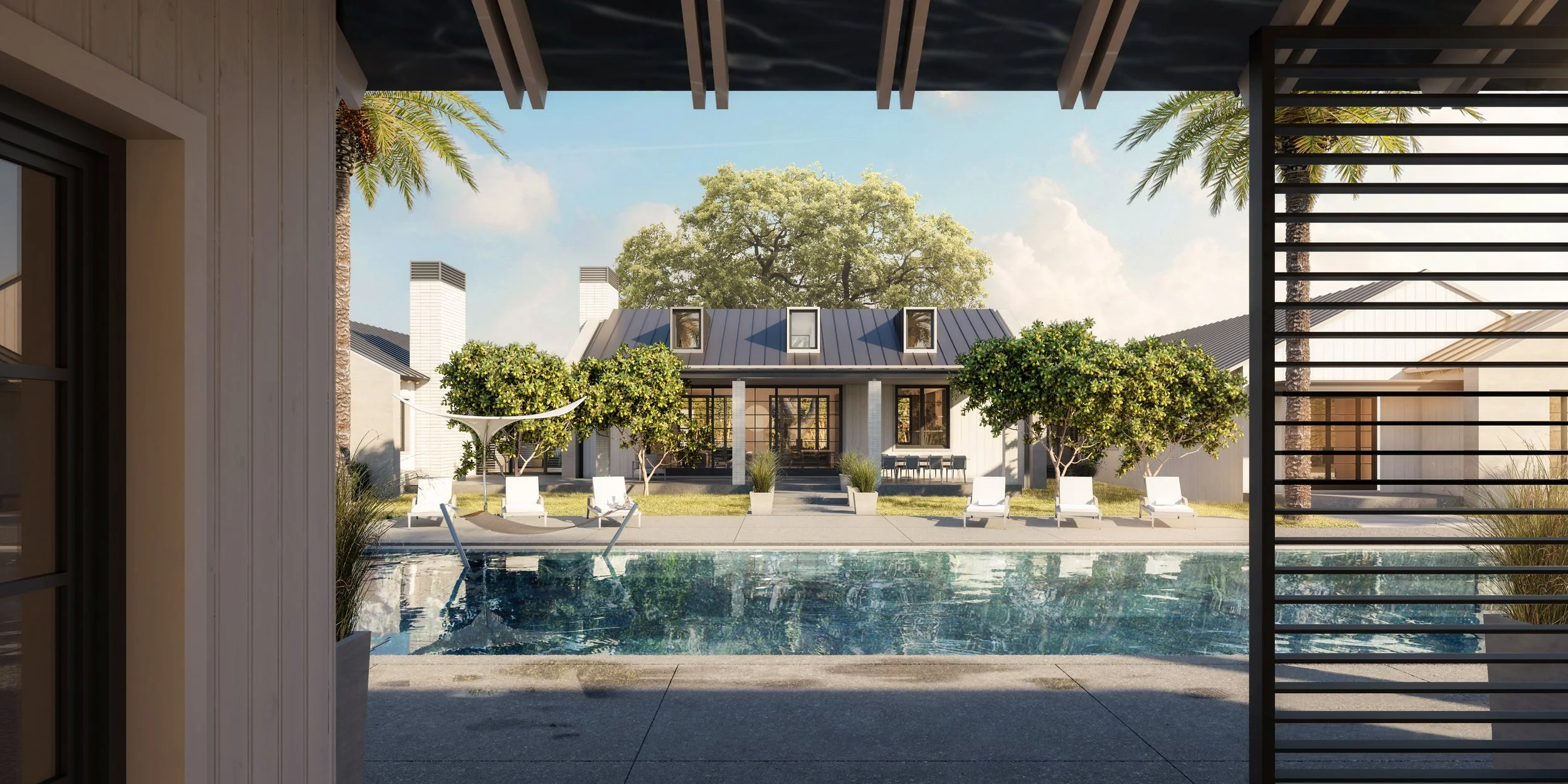 Modern ranch-style home with sleek metal roof, large windows, and a serene pool area, surrounded by citrus trees and sun loungers, creating a luxurious and peaceful retreat.