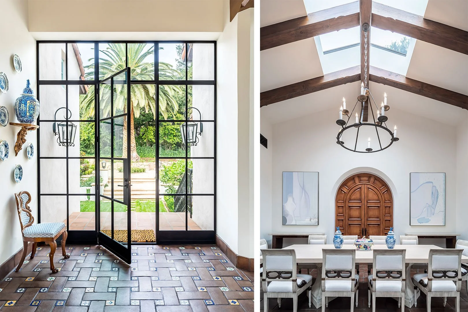 Entryway with wrought iron and glass doors opening to a tiled patio framed by lush greenery and a palm tree, accentuated by blue and white ceramic decor on the walls.
