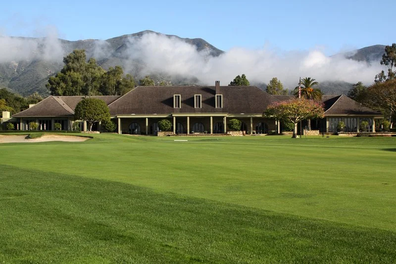 Birnam Wood Country Club with expansive golf course and mountain views, designed by The Warner Group Architects, Inc., blending traditional and contemporary architectural elements.