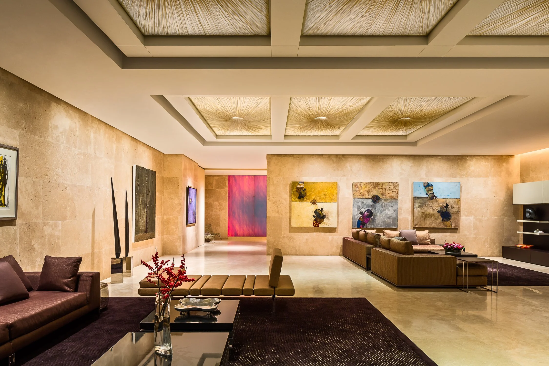 Luxurious modern living area with artistic wall decor and unique ceiling design.